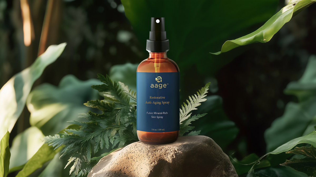 aage fulvic mineral face spray bottle on a rock among ferns